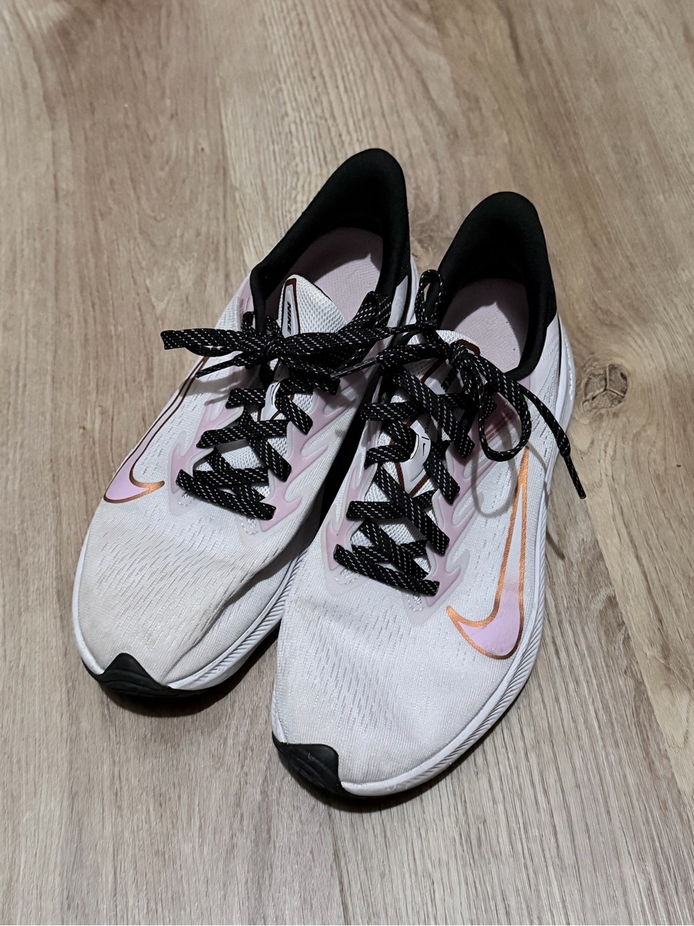 Nike Women's White Running Shoes with Pink and Orange Swoosh